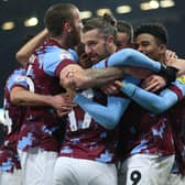 Burnley's Manuel Benson (centre) is congratulated by his team mates after scoring his second goal of the game during the Sky Bet Championship match at Turf Moor, Burnley. Picture: Barrington Coombs/PA Wire.