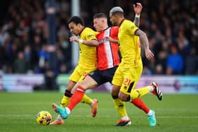 SQUEEZING THE ORANGES: Cameron Archer (left) and Vinicius Souza (right) get close to Luton Town's Ross Barkley