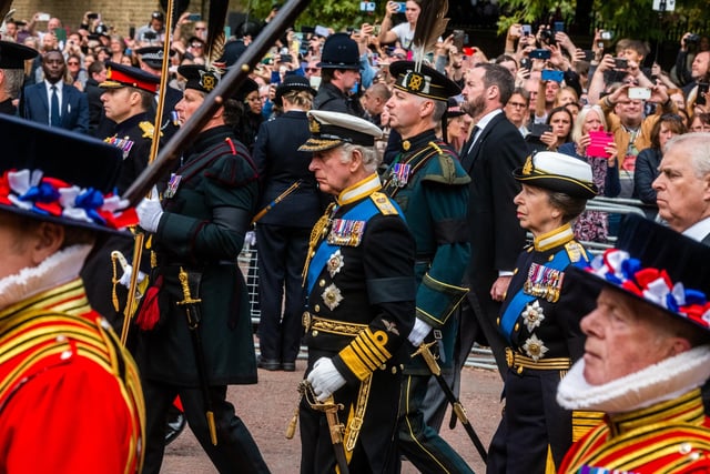 The State Funeral of Her Majesty The Queen, on The Mall, London. Pictured King Charles III, walking with HRH Princess Anne, and Prince Andrew Duke of York.