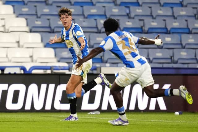 HEAD BOY: Huddersfield Town's Daniel Vost enjoys his goal, pursued by Cameron Ashia (Image: Nick Potts/PA Wire)