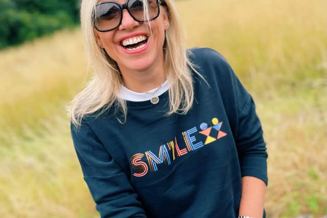 Clare wears SMILE sweatshirt, £40
