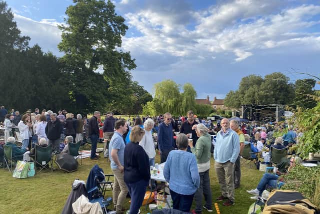 People gather and enjoy music at a previous Northern Aldborough Festival.