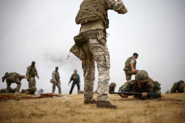 Ukraine Army recruits take part in a training session called "The battle of Innoculation training" with members of Britain's and other international partners' armed forces personnel, at a Ministry of Defence (MOD) training base in southern England on June 20, 2023.(Photo by HENRY NICHOLLS / AFP)