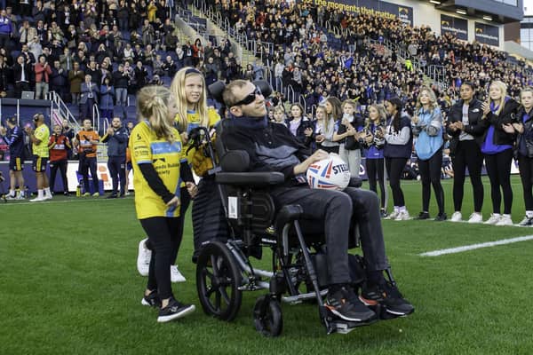 Rob Burrow brings out the match ball with daughters Macy and Maya ahead of Leeds Rhinos' game against New Zealand at Headingley. (Picture: Allan McKenzie/SWpix.com)