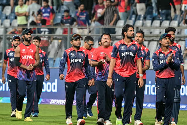Nepal's players take a lap of honour at the Wankhede Stadium. Photo by Indranil MUKHERJEE / AFP via Getty Images