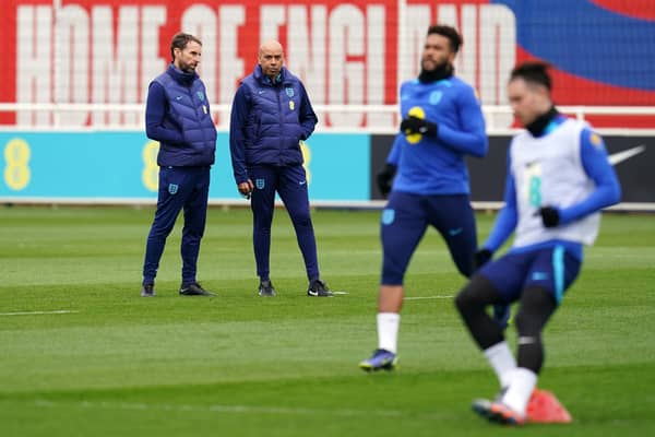 PLANNING AHEAD: England manager Gareth Southgate and coach Paul Nevin look on during Wednesday's training session at St. George's Park, Burton-on-Trent. Picture: Nick Potts/PA