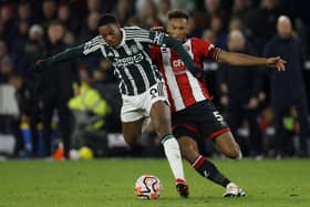 FACING THE CHALLENGE: Sheffield United's Auston Trusty matches up with Manchester United striker Anthony Martial (left)