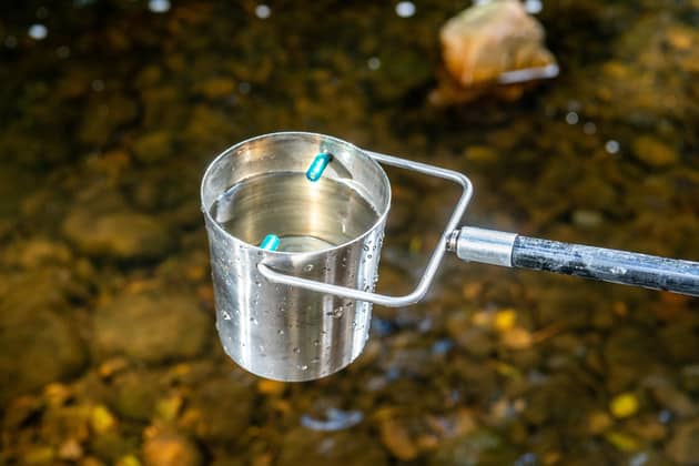Water samples being collected from the River Nidd at Duffers Pool at Darley, near Harrogate. PIC: James Hardisty