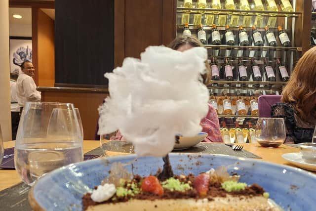 Candy floss tree atop a creme brulee dessert at the Chef's Table dining experience. Picture credit: Amy Crowther