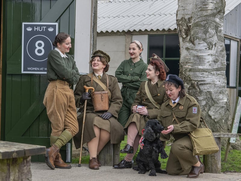 Women's land army re-enactors Eleanor Turner, Marie Mckendry, Charlotte Turner, Alex Mckendry and Emma Turner with Bonnie the dog.