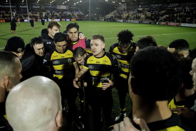 Liam Harris, who misses out through injury this week, leads a huddle after York's famous victory over Hull KR. (Photo: Allan McKenzie/SWpix.com)