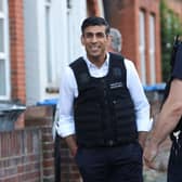 Prime Minister Rishi Sunak watches an immigration raid in north west London. Picture date: Thursday June 15, 2023. Photo credit should read: Susannah Ireland/PA Wire