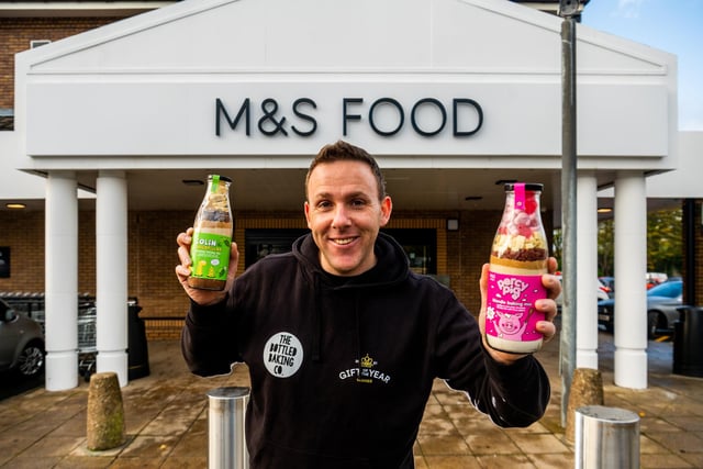 Greg is pictured with his Percy Pig™ and Colin the Caterpillar™ baking mixes