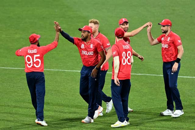 England's Chris Jordan (second left) celebrates after catching out New Zealand's Daryl Mitchell during the T20 World Cup Super 12 match at The Gabba in Brisbane, Australia. Picture: PA