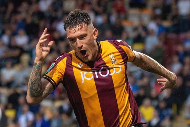 BACK IN THE GAME: Andy Cook headed Bradford City into the lead on his first start since Boxing Day
Bruce Rollinson