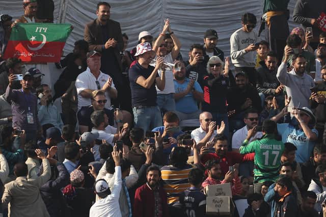 Simon Finch, the Barmy Army trumpeter, entertains the crowd in Rawalpindi. Photo by Matthew Lewis/Getty Images.
