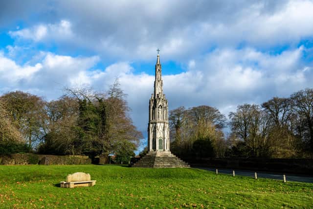 Sledmere - Village of The Week. Pictured A replica Eleanor Cross was erected in Sledmere, East Riding of Yorkshire, in 1896-1898. The tall stone structure was constructed by the Sykes family of Sledmere. Engraved monumental brasses were added after the First World War, converting the cross into a war memorial. Picture By Yorkshire Post Photographer,  James Hardisty. Date: 22nd January 2024.