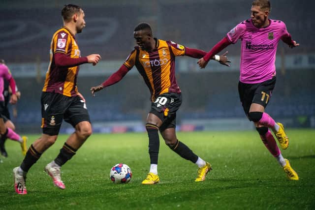 Abo Eisa goes past Mitch Pinnock during Bradford City's defeat by Northampton Town. (Picture: Bruce Rollinson)