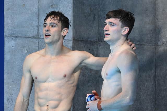 Gold medallists Britain's Thomas Daley (L) and Matty Lee react after winning the men's synchronised 10m platform diving final event during the Tokyo 2020 Olympic Games (Picture: OLI SCARFF/AFP via Getty Images)