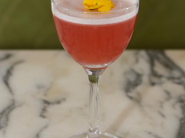It's a take on a cosmopolitan but with Haku Vodka, white peach, passionflower, cranberry and lemon oil