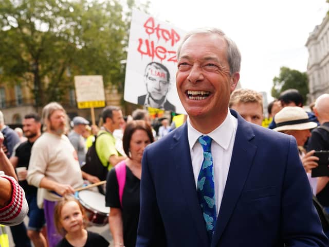 Nigel Farage speaks with protesters outside Downing Street in central London, on the first day of the expansion of the ultra-low emission zone (Ulez) to include the whole of London. Picture: Victoria Jones/PA Wire