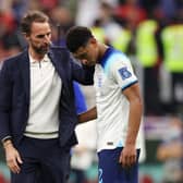 Compassion: Gareth Southgate released the shackles of England in players like Jude Bellingham, right, but it still ended in World Cup disappointment as they lost to France on Saturday night. (Picture: Richard Heathcote/Getty Images)