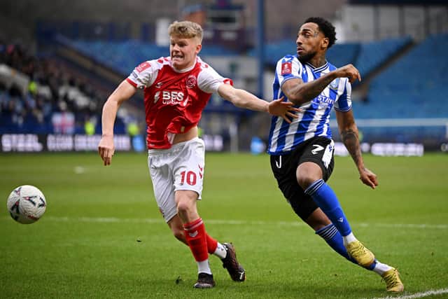 Scott Robertson of Fleetwood Town battles for possession with Mallik Wilks of Sheffield Wednesday during the Emirates FA Cup Fourth Round draw between Sheffield Wednesday and Fleetwood Town at Hillsborough (Picture: Clive Mason/Getty Images)