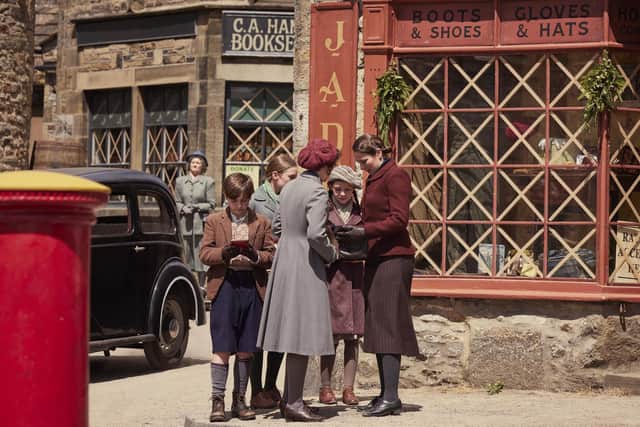 Christopher Taylor (Owen Phillips) and Mrs Hall (Anna Madeley) in Grassington used for filming Darowby in the All Creatures Great and Small Christmas Special. Channel 5/Playground