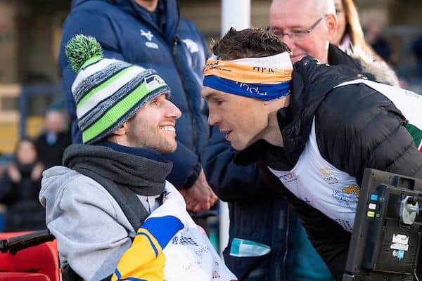 Kevin Sinfield meets Rob Burrow at the Headingley finish line after running 101 miles from Leicester in 24 hours two years ago. (Photo: Allan McKenzie/SWpix.com)