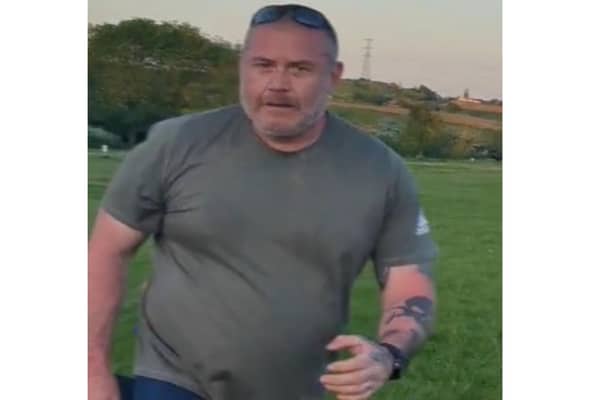 Police want to speak to the man pictured after a 44-year-old man was punched multiple times in Charnock Recreation Grounds, off Carter Hall Lane, by an attacker who accused him of kicking his dog.