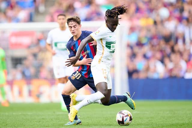 BARCELONA, SPAIN - SEPTEMBER 17: Pablo Paez Gavira 'Gavi' of FC Barcelona duels for the ball with Domingos Quina of Elche CF  during the LaLiga Santander match between FC Barcelona and Elche CF at Spotify Camp Nou on September 17, 2022 in Barcelona, Spain. (Photo by Alex Caparros/Getty Images)