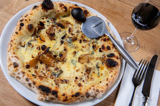 Rind at Crows Nest Barn, based at the  Courtyard Dairy at Austwick, near Settle, photographed for The Yorkshire Post Magazine by Tony Johnson. Blue cheese pizza made with Devon Blue Cream, Cote Hill Blue, roasted pear and walnut.