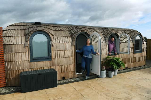 Sally with son Sam and one of the Iglu glamping pods. (Pic credit: Jonathan Gawthorpe)