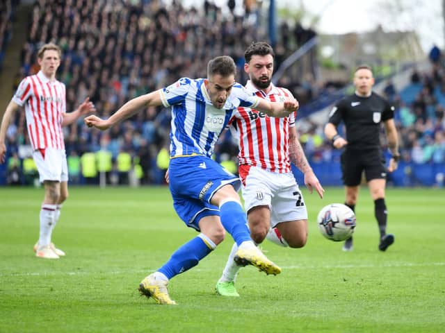 Pol Valentin of Sheffield Wednesday shoots and misses while under pressure from Sead Haksabanovic of Stoke City during the Sky Bet Championship match at Hillsborough. Photo by Ben Roberts Photo/Getty Images.