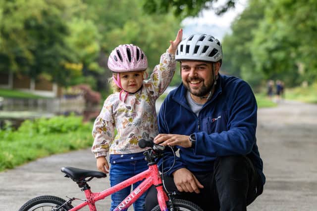 Annie Thompson and her father, who cycle to nursery every day