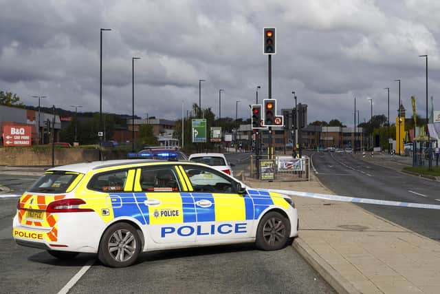 Penistone Road was closed all day following a crime spree on the road in which two cars were stolen and four people, including two special constables, were injured. Picture: Scott Merrylees