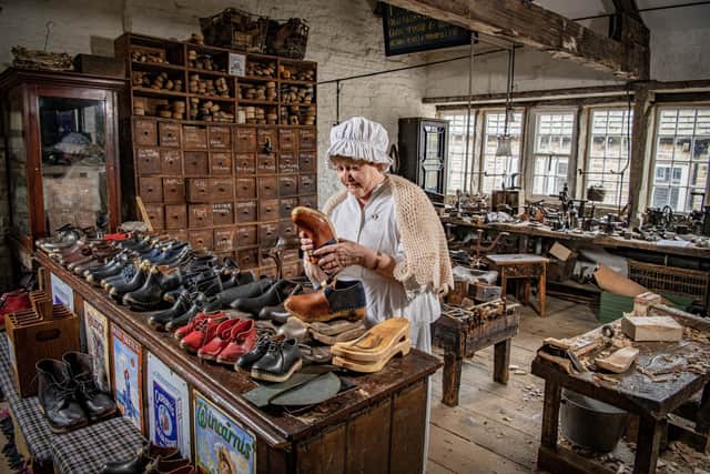 Anne Hodge looks at the handmade clogs in the Clog Shop in The Colne Valley Museum in Golcar near Huddersfield, photographed for The Yorkshire Post by Tony Johnson.