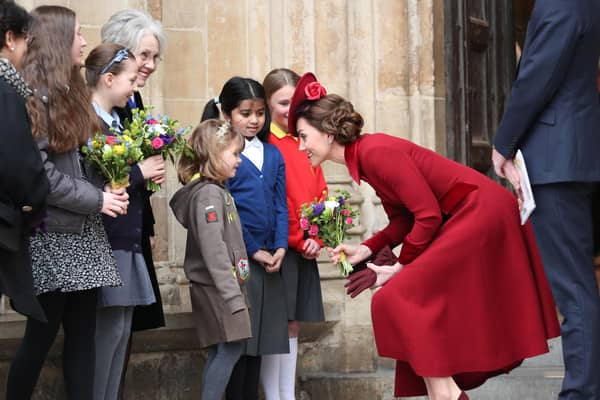 Duchess of Cambridge speaks to school children as she leaves after the Commonwealth Service at Westminster Abbey. PIC: Yui Mok/PA Wire