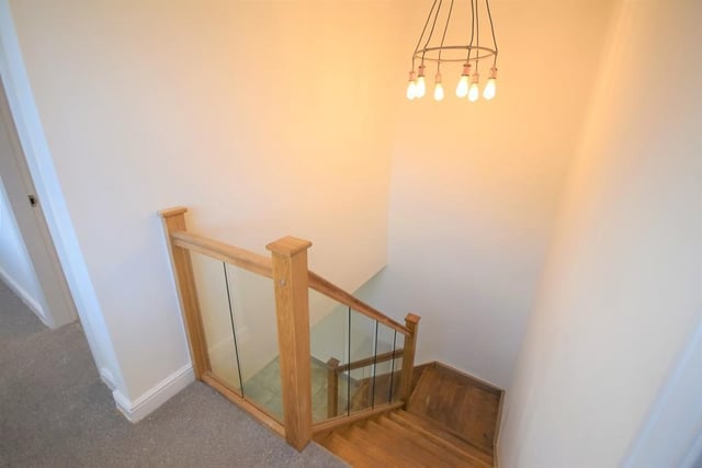 A large first floor landing with three UPVC double glazed windows allowing in an abundance of natural light. With feature radiators and downlights, Oak doors leading to the bedrooms, bathroom and loft access.