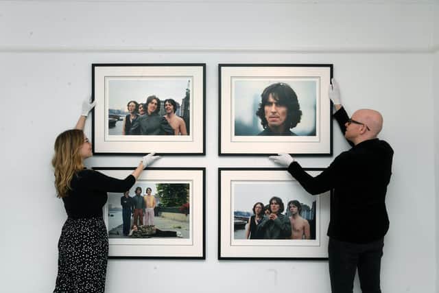 Redhouse Originals gallery manager Emily Merriott and director Richard McTague arrange images by Tom Murray from The Beatles: Mad Day Out photography exhibition. Picture Jonathan Gawthorpe