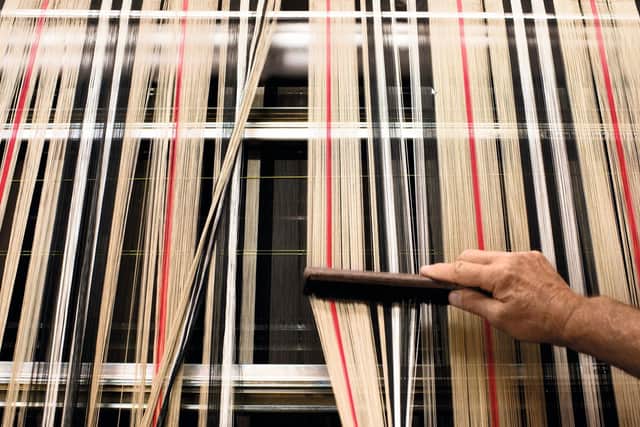The iconic Burberry Check is woven at the Burberry mill in Keighley. Courtesy of Burberry.