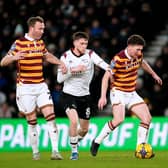 Derby County's Max Bird (centre) battles for the ball with Bradford City's Richard Smallwood (right) and Kevin McDonald during the EFL Trophy round of 16 match in January. Picture: Nick Potts/PA Wire.