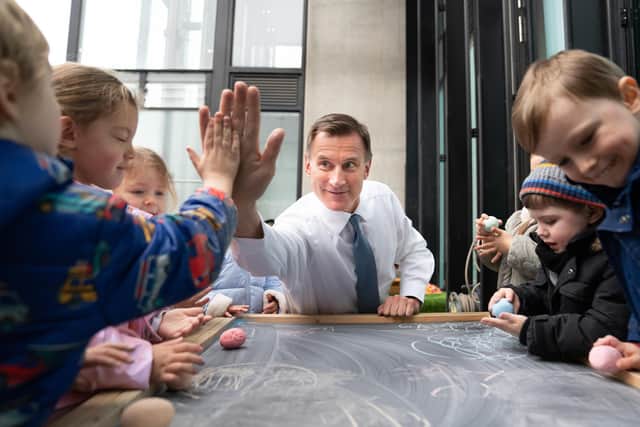 Chancellor of the Exchequer Jeremy Hunt, meeting children during a visit to Busy Bees Battersea Nursery in south London, after delivering his Budget