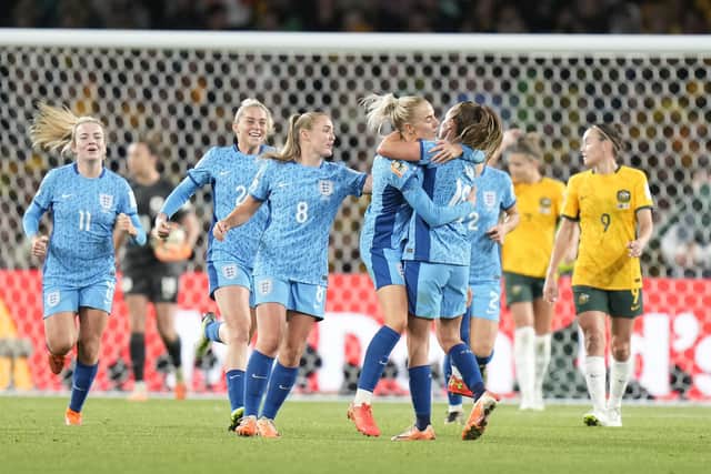 England players celebrate after England's Ella Toone scored her side's opening goal during the Women's World Cup semifinal soccer match between Australia and England at Stadium Australia in Sydney, Australia, Wednesday, Aug. 16, 2023. (AP Photo/Alessandra Tarantino)
