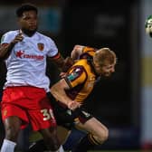SERIOUS INJURY: Hull City are not banking on seeing Benjamin Tetteh (left, with Bradford City's Brad Halliday) again until 2023