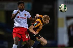 SERIOUS INJURY: Hull City are not banking on seeing Benjamin Tetteh (left, with Bradford City's Brad Halliday) again until 2023