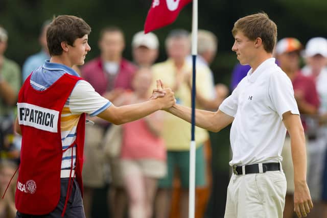 Matt Fitzpatrick shakes hands with his caddie Alex Fitzpatrick after winning during the final round of match play at the 2013 U.S. Amateur at The Country Club in Brookline, Mass. on Sunday, Aug. 18, 2013.  (Copyright USGA/John Mummert)