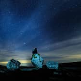 A walker looks up into the night sky above Twistleton Scar in The Yorkshire Dales National Park. PIC: Danny Lawson/PA Wire