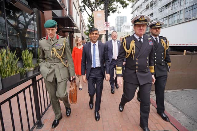 Prime Minister Rishi Sunak with (left to right) Col Jaimie Norman, Admiral Sir Ben Key, First Sea Lord, and Commander Gus Carnie during his visit to San Diego, US for meetings with US President Joe Biden and Prime Minister of Australia Anthony Albanese as part of Aukus, a trilateral security pact between Australia, the UK, and the US. Picture date: Monday March 13, 2023. PA Photo. See PA story POLITICS Aukus. Photo credit should read: Stefan Rousseau/PA Wire