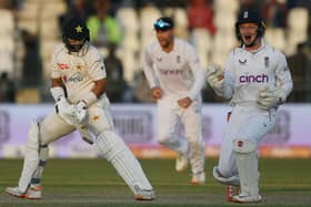 Breakthrough: England's wicketkeeper Ollie Pope, right, celebrates  the dismissal of Pakistan's Imam-ul-Haq during the fading light of day three of the second Test. (Picture:  Aamir QURESHI / AFP)